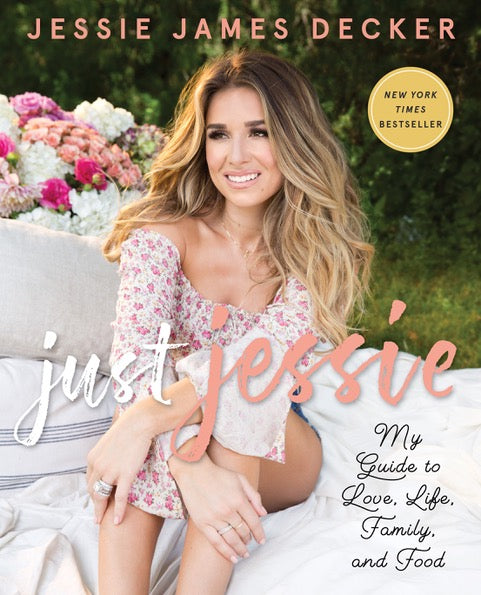 Book cover featuring a woman sitting outdoors with flowers, titled 'Just Jessie' by Jessie James Decker.
